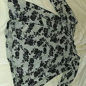 A soft gray material with black roses on in